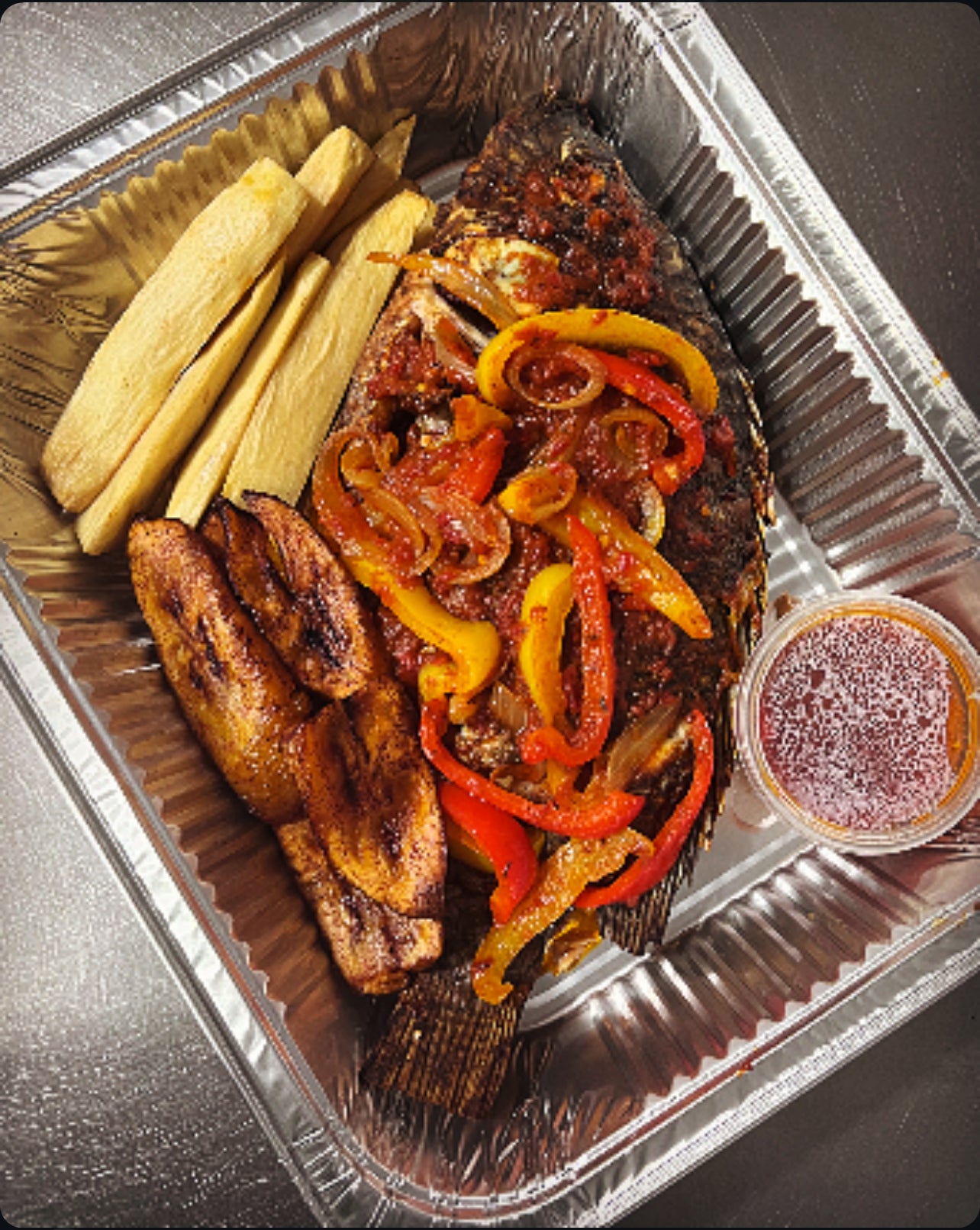 Grilled Crocker fish large-served with yam fries and plantain