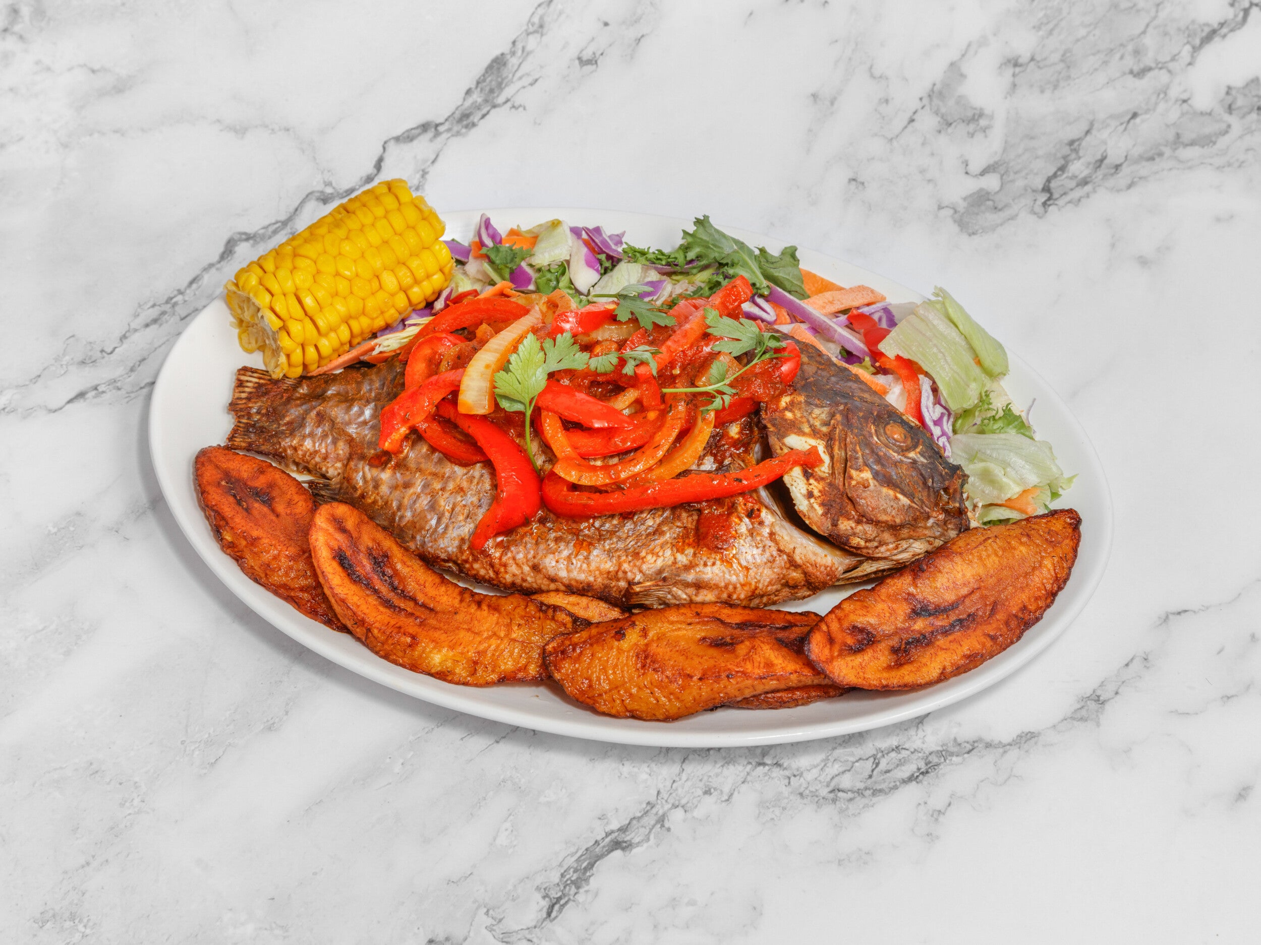 Grilled fish Tilapia with yam fries and plantain