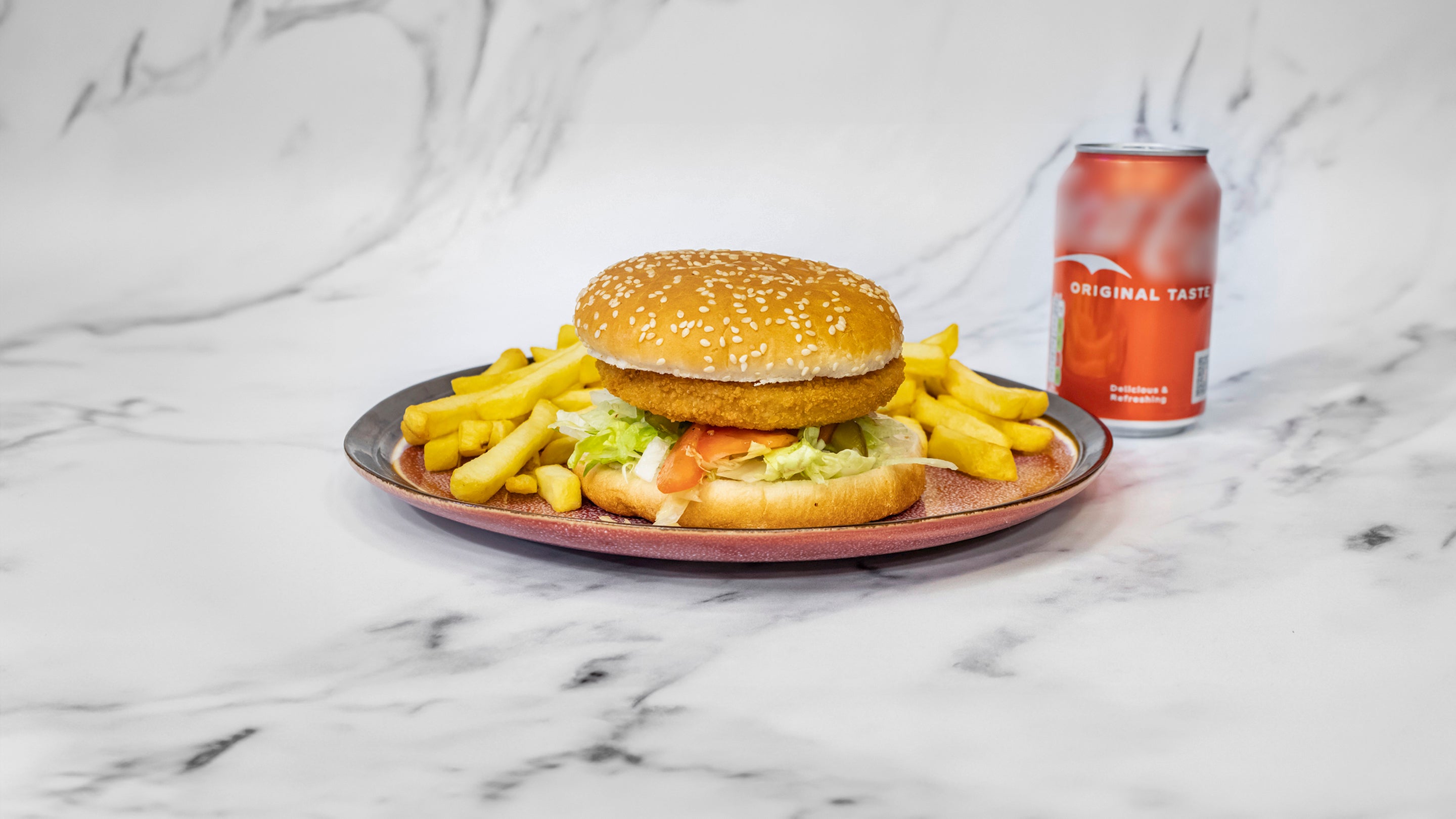 Vegan burger served with chips