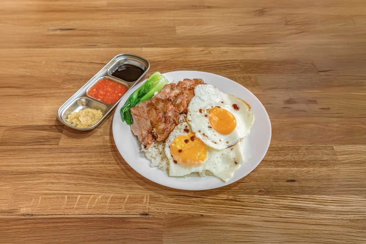 N. 黯然销魂饭(叉烧及绝配煎双流心太阳蛋) Honey roasted pork with Two sunny side up eggs