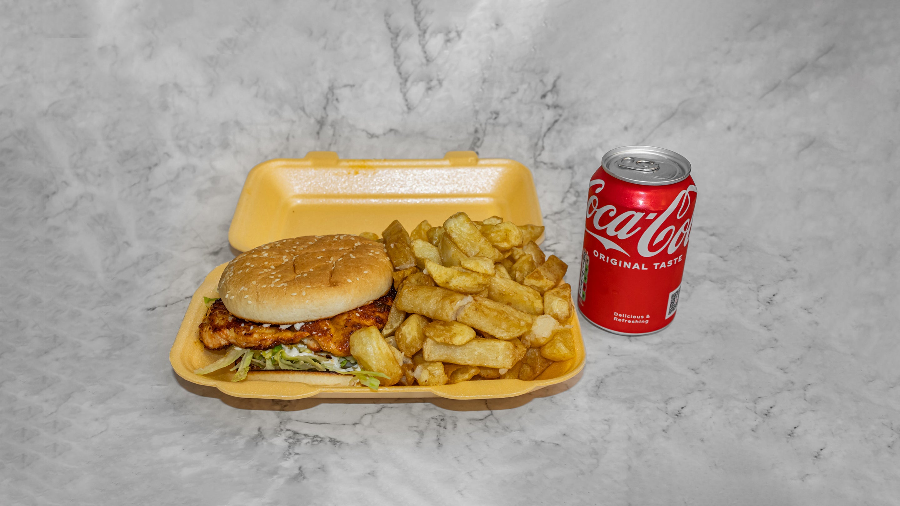 Spicy grilled chicken burger meal