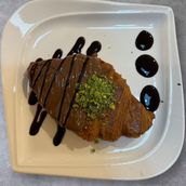 Flat Croissant With Chocolate And Pistachios
