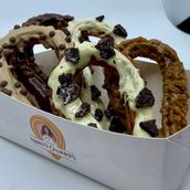 Rounded churros with sauces and cookies