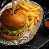 CHICKEN BURGER WITH FRENCH FRIES AND TOMATO KETCHUP