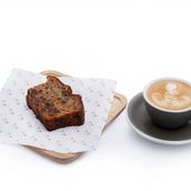 A Slice Of Banana Bread And Hot Or Iced Coffee