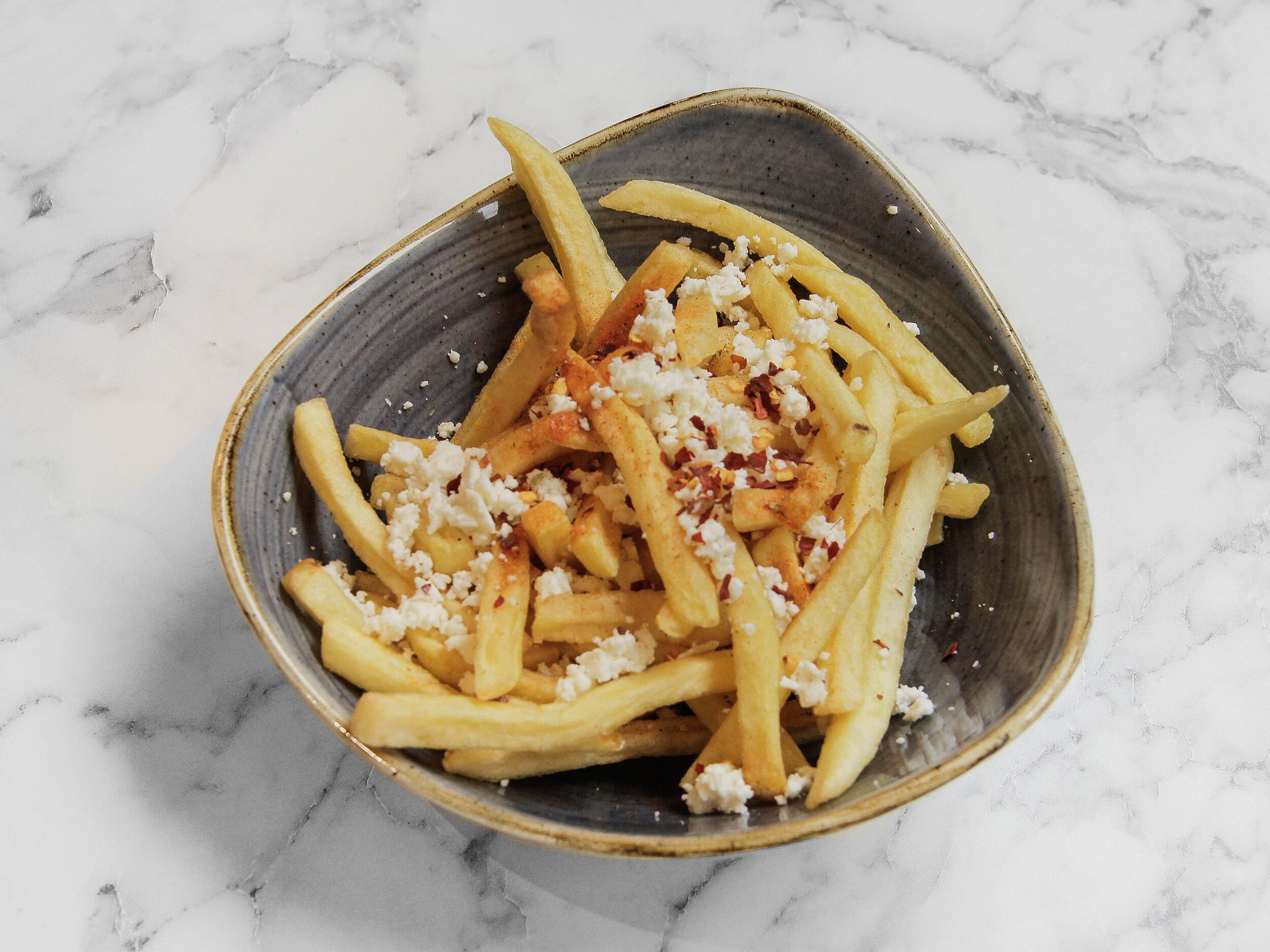 Potato Fries, Crushed Feta, and Chilli