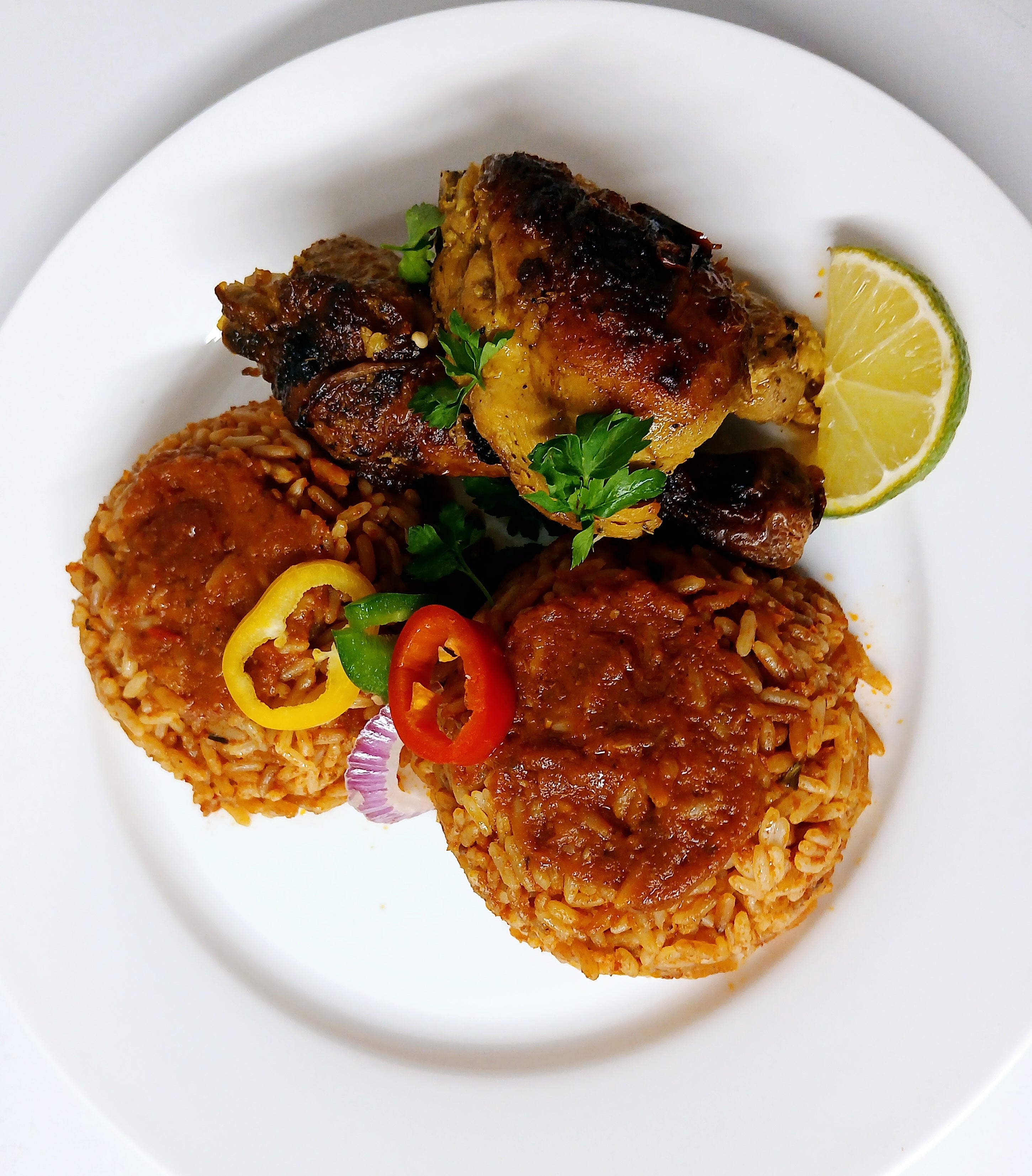 Jollof rice with grilled curry chicken