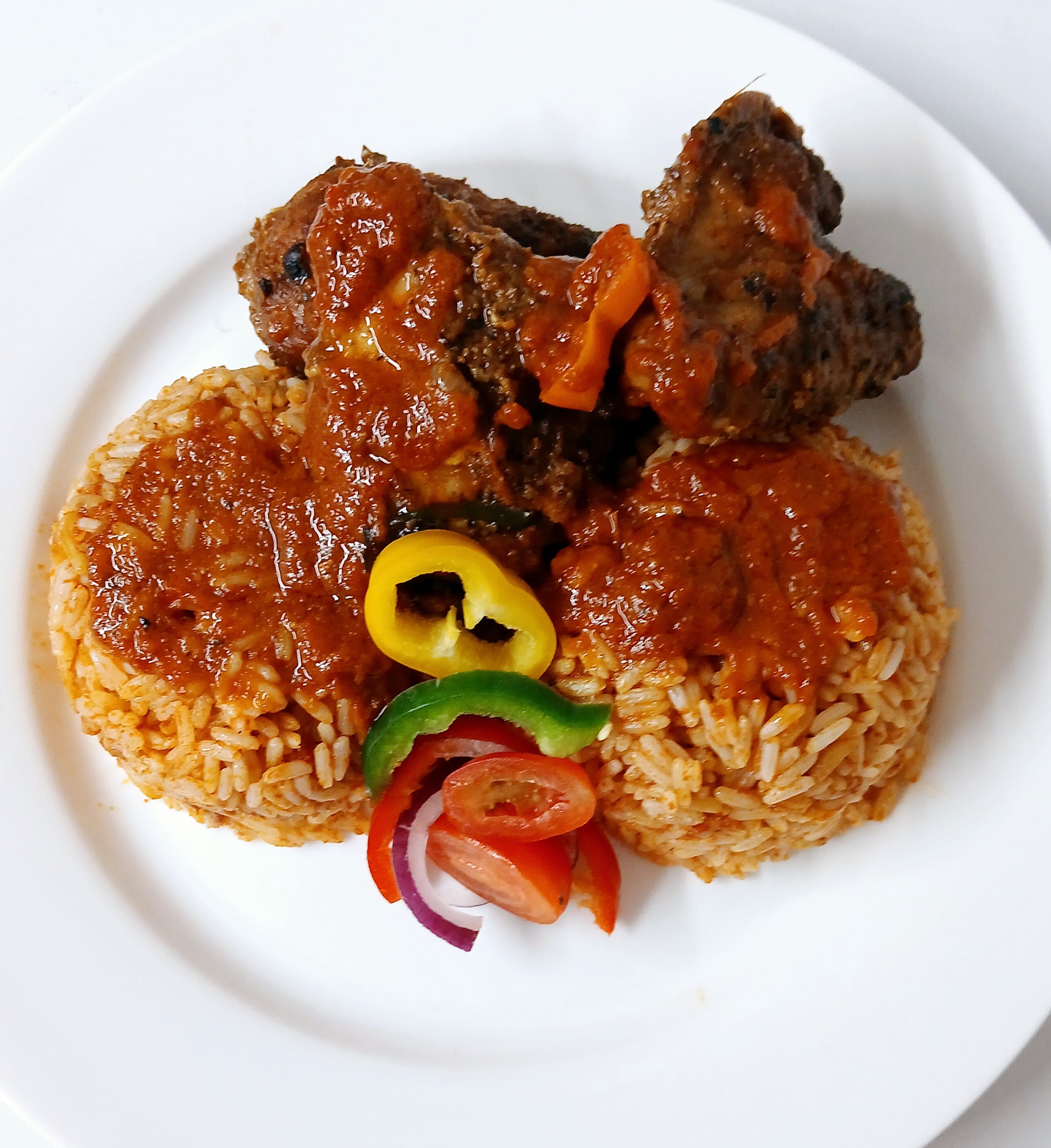 Jollof rice with grilled creole chicken