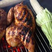 Half Grilled Chicken On Charcoal