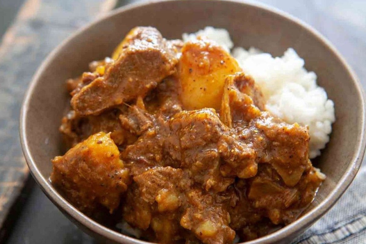 Curry Goat with 250ml sugarcane juice