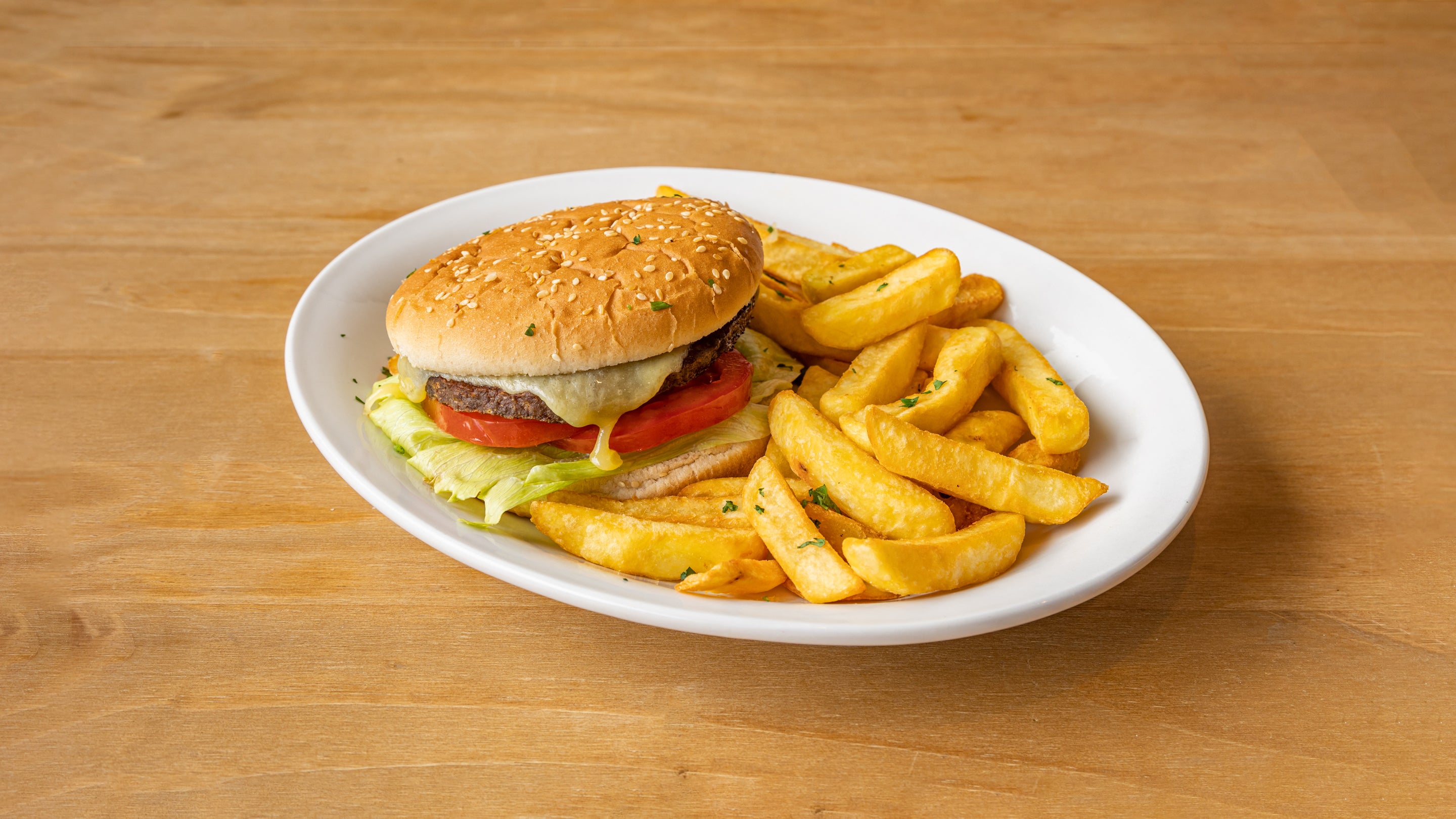 Beef burger in homemade bread (bolo do caco) And chips