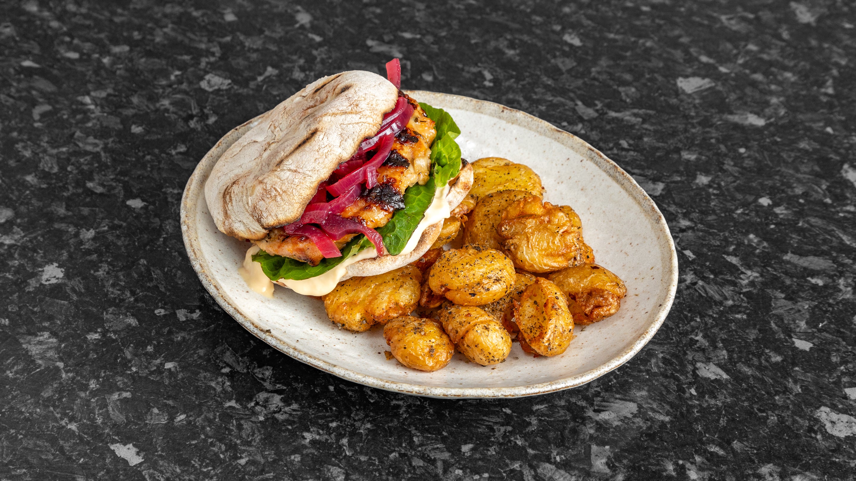 Grilled chicken thigh, Caesar mayo, baby gem, pickled red onion