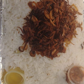 plate of white rice with onions