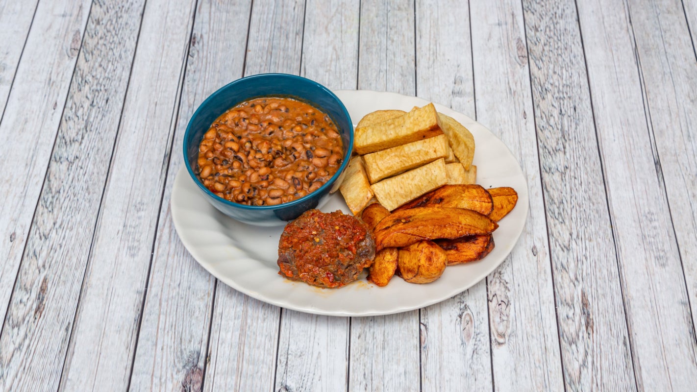 Porridge beans with beef, Fried yam and Fried Plantain