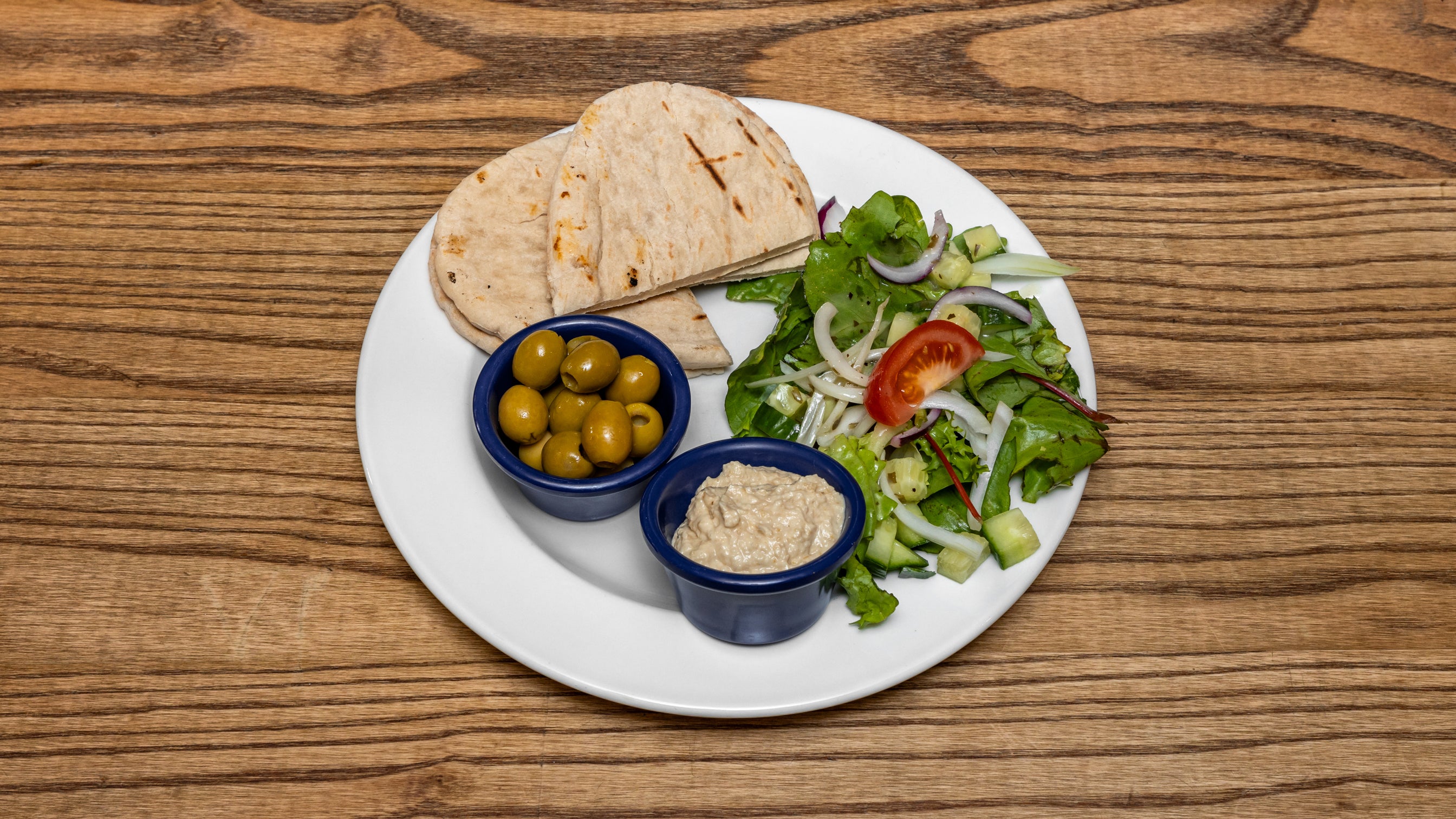Hummus with Warm Pitta, Olives, and a Side Garnish