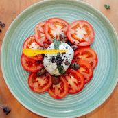 Burrata con carpaccio di pomodori, olive taggiasche e crema di peperoni (Contains Dairy - Milk, Vegetarian)