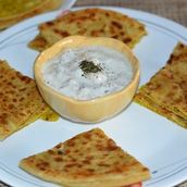 1 Crispy Aloo Paratha Served With Fried Green Chili And Fresh Curd