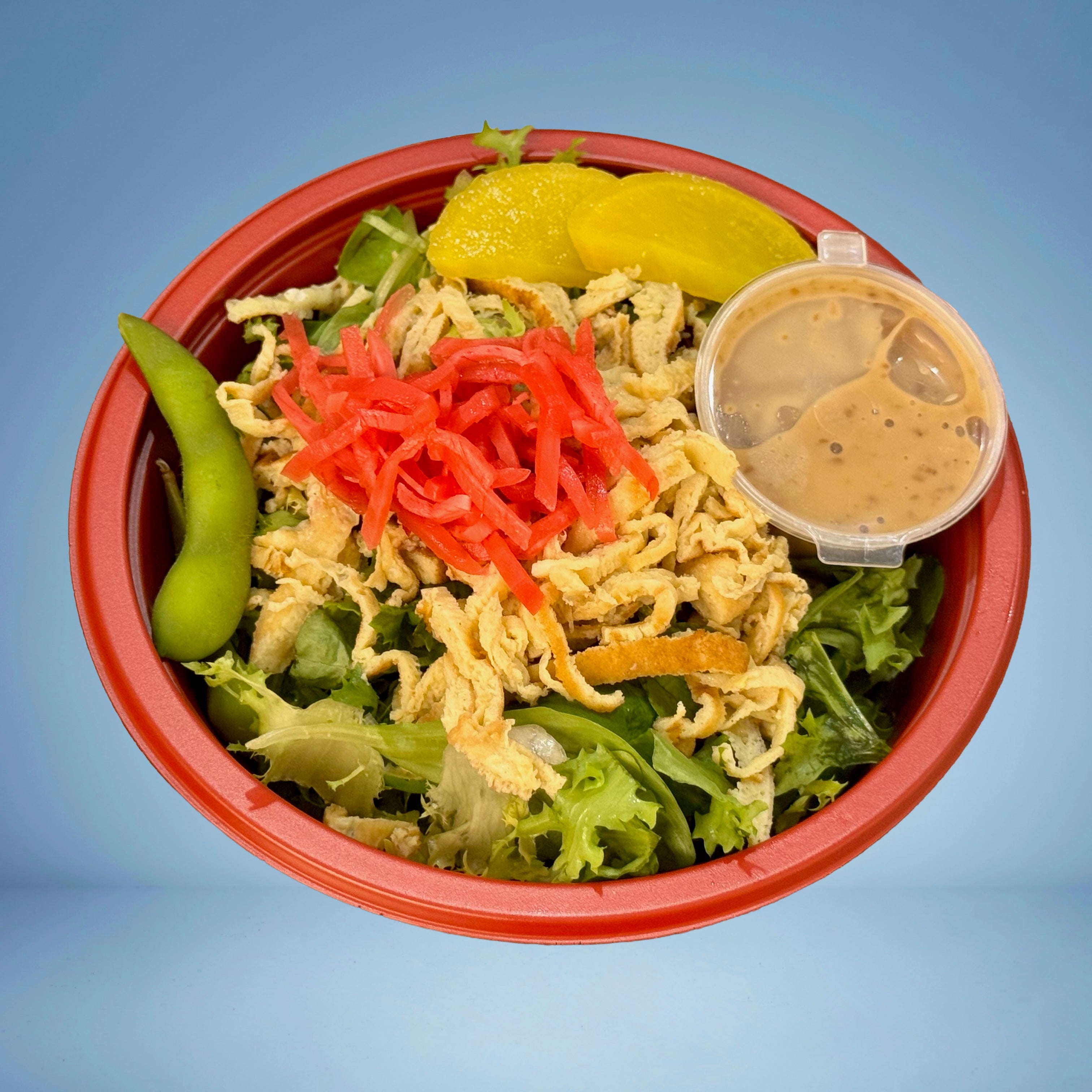 Green Salad in Traditional Japanese Sesame Dressing served with half boiled egg