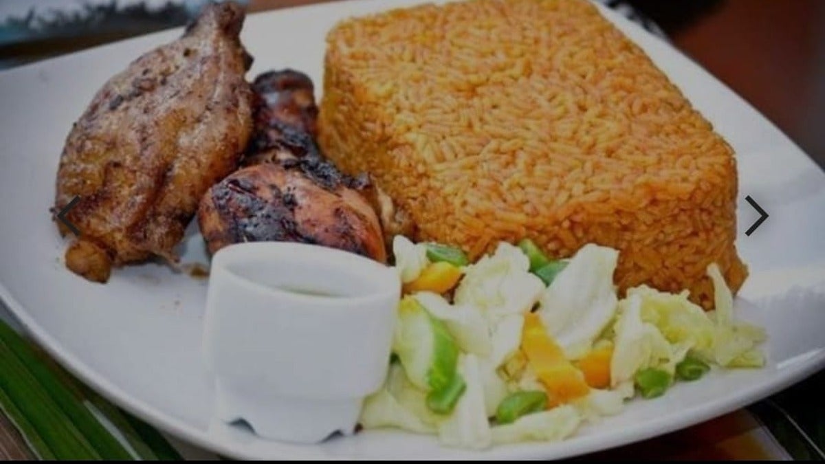 Jollof rice served with chicken