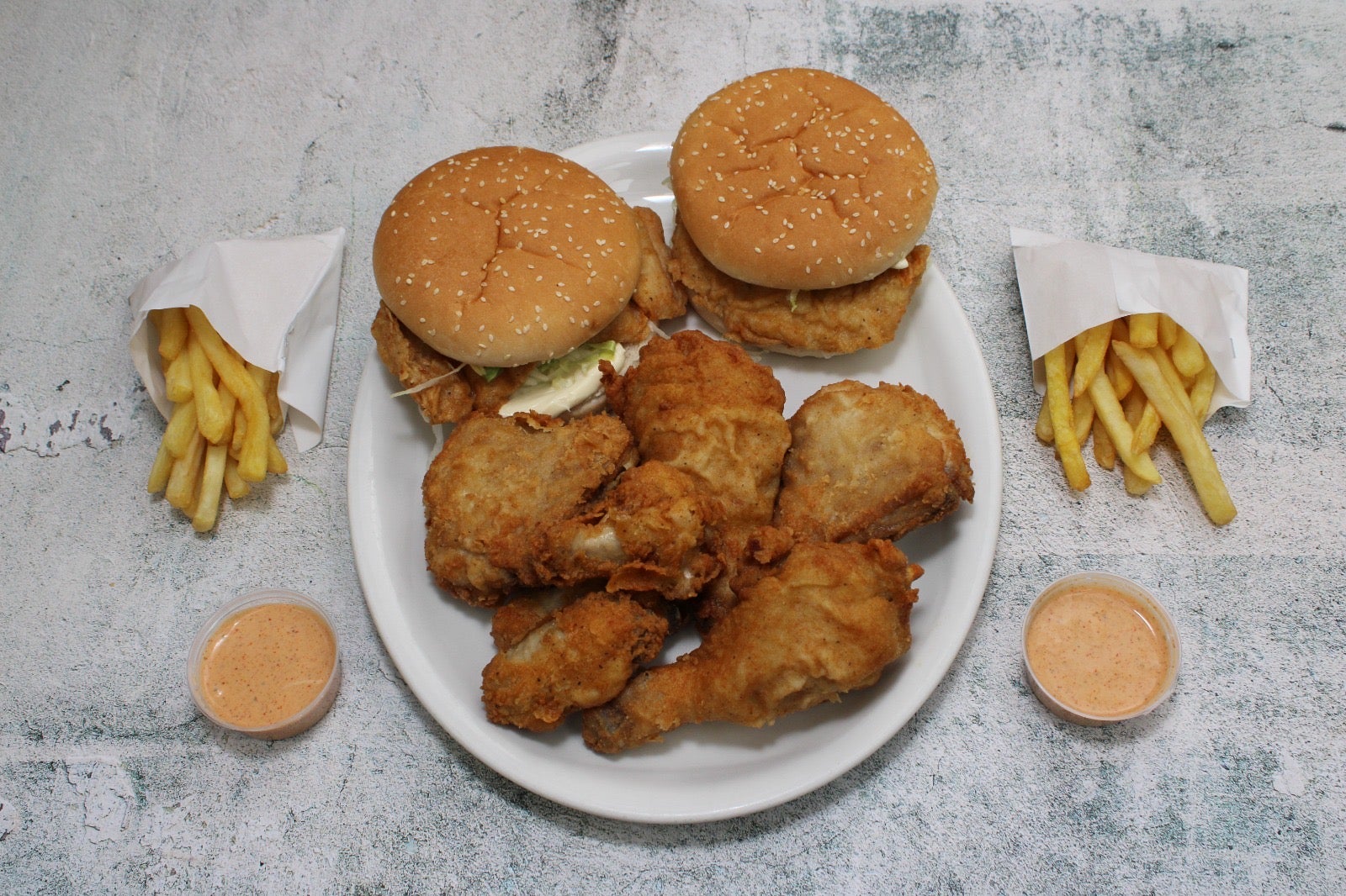 2 Chicken Fillet Burgers, 4 Piece Chicken, 4 Spicy Wings, 2 Regular Fries, and 2 Special Chilli Sauce