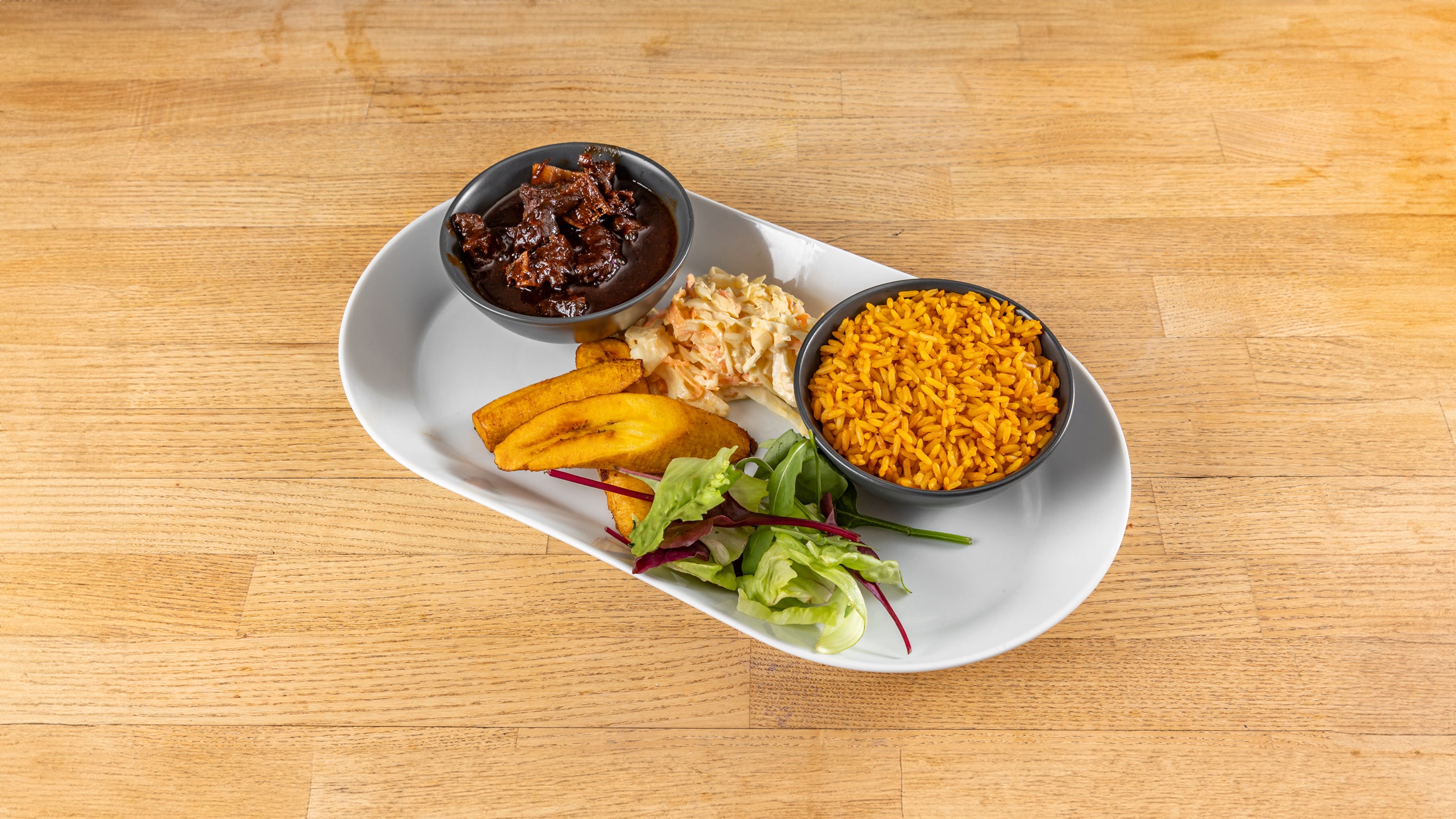 Oxtail or Curry Goat with 3 Sides