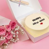 Black write happy new year cake With flowers pink 