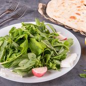 Plate Of Cheese With Fresh Herbs.