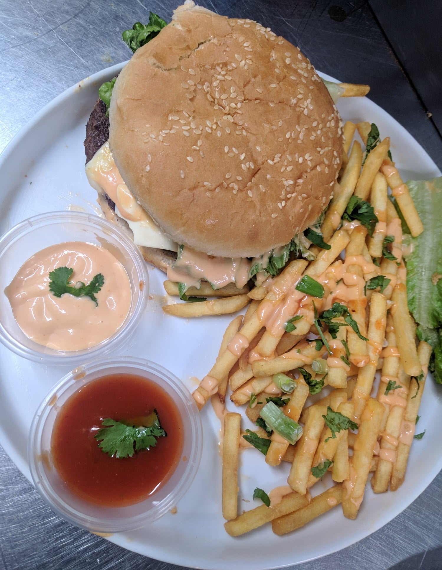 Beef Burger with chips and free Pepsi Max plus tomato sauce.