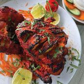 TANDOORI FULL CHICKEN Chutney with salad and hummus and kuboos