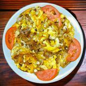 Eggs with onions and tomato slice