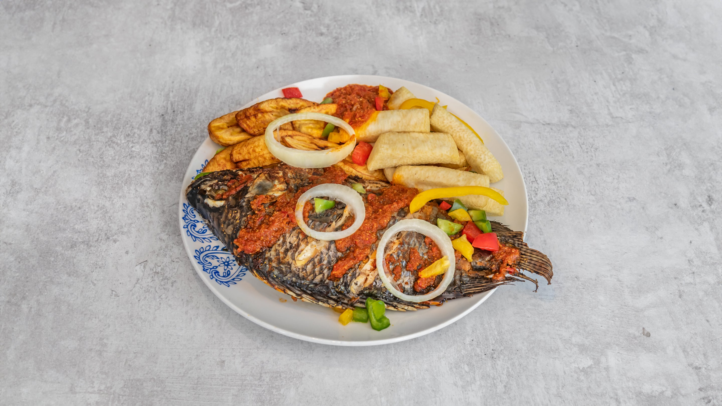 Grilled Tilapia Fish served with coleslaw,Fried Yam, or Plantain
