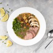 Beef Broth Soup With Fried Potatoes, Coriander, And Mushrooms