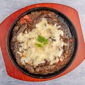Sausage Casserole Tapped With Cheese With Bread And Pickles