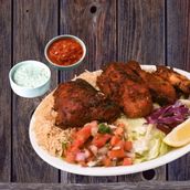 Half Chicken Kebab with Kabuli Rice, Afghani Salad, Raita and Red Sauce. Must Try Combo