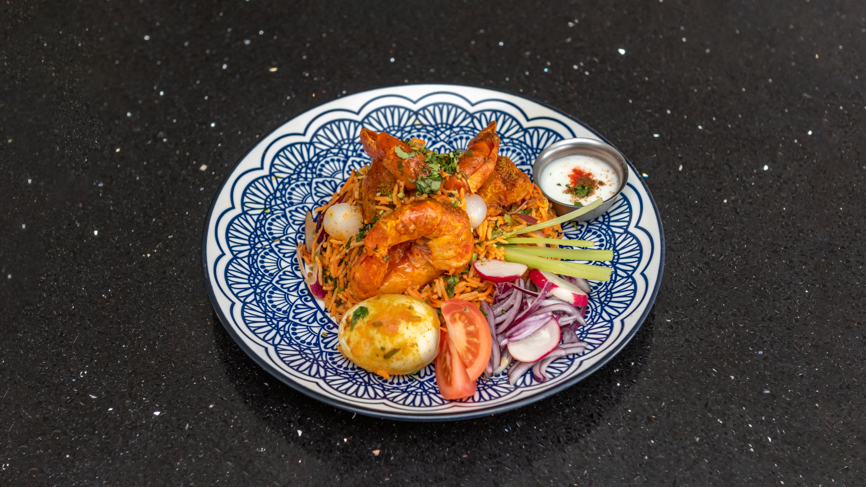 King Prawn Biryani, Served with Egg & Raita.