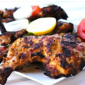 Half chicken grilled on charcoal