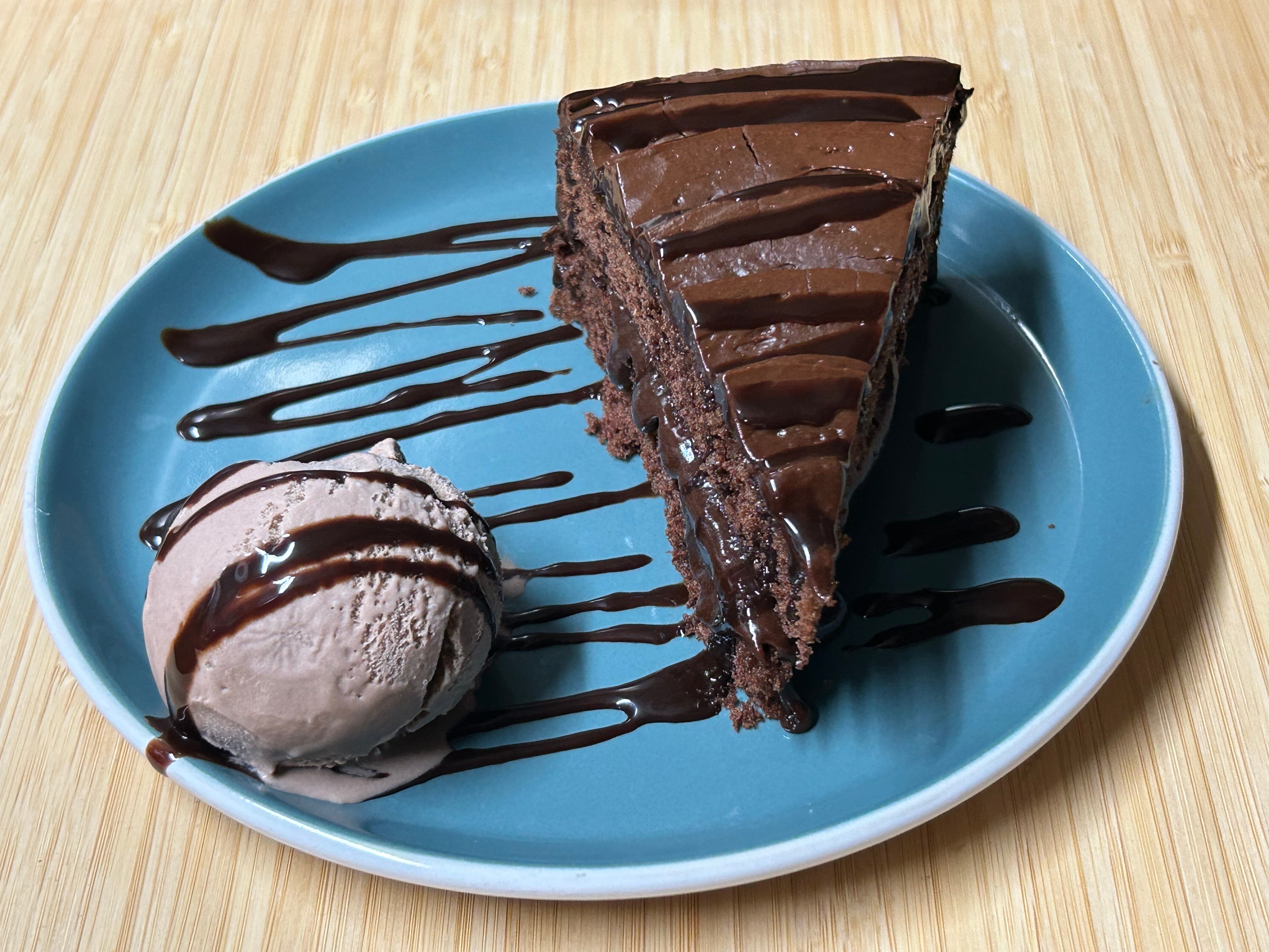 Chocolate Fudge Cake Served with a scoop of Chocolate Ice-cream And Hersheys Sauce