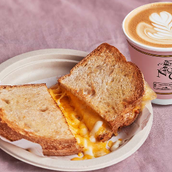 1 Cheesy Sourdough + 1 Cuppuccino