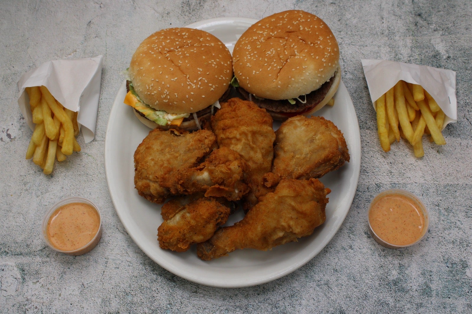 2 Quarter Pounders, 4 Piece Chicken, 4 Spicy Wings, 2 Regular Fries, and 2 Special Chilli Sauce