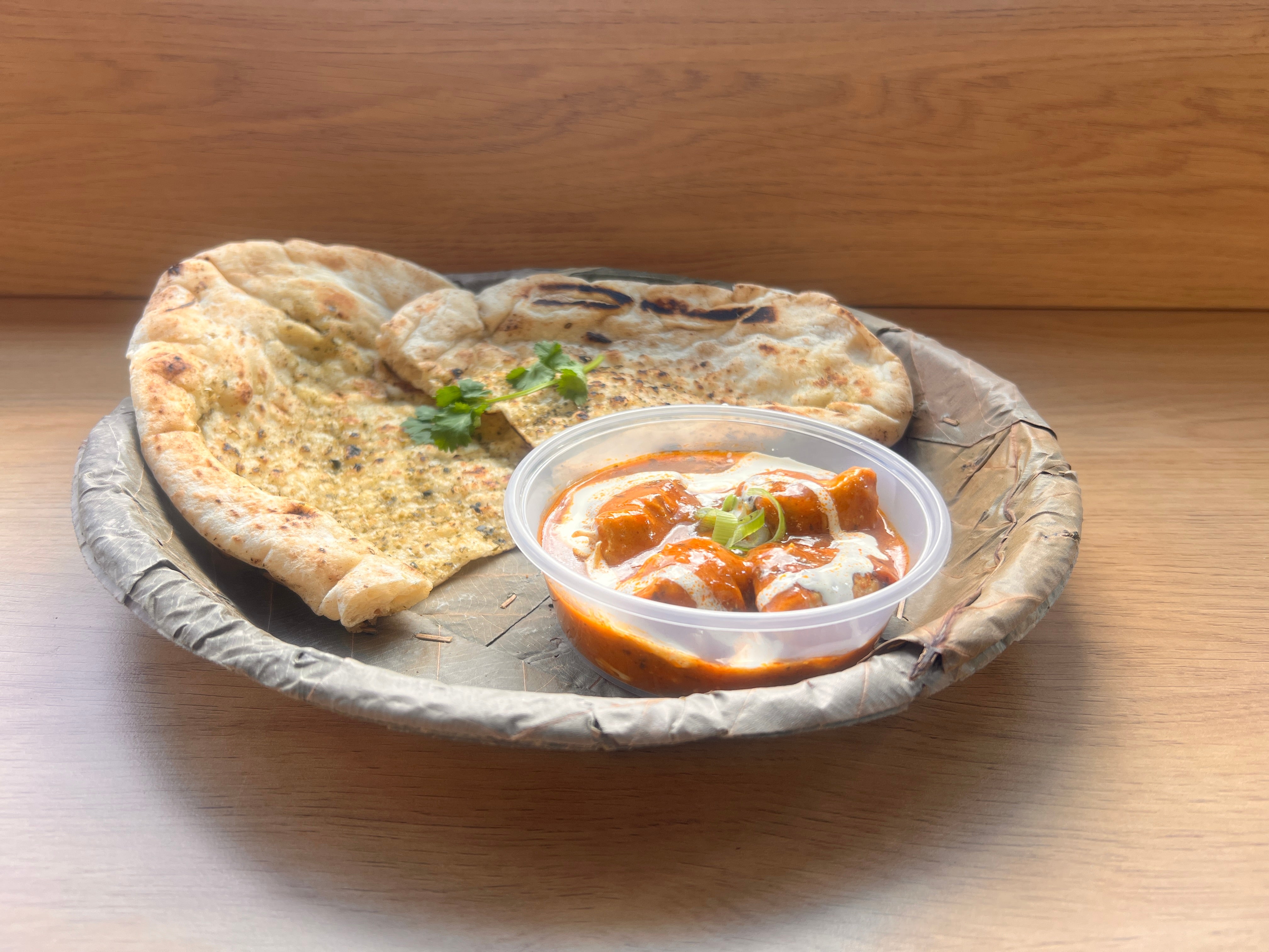 Garlic Naan roti (Bread) with chicken Curry