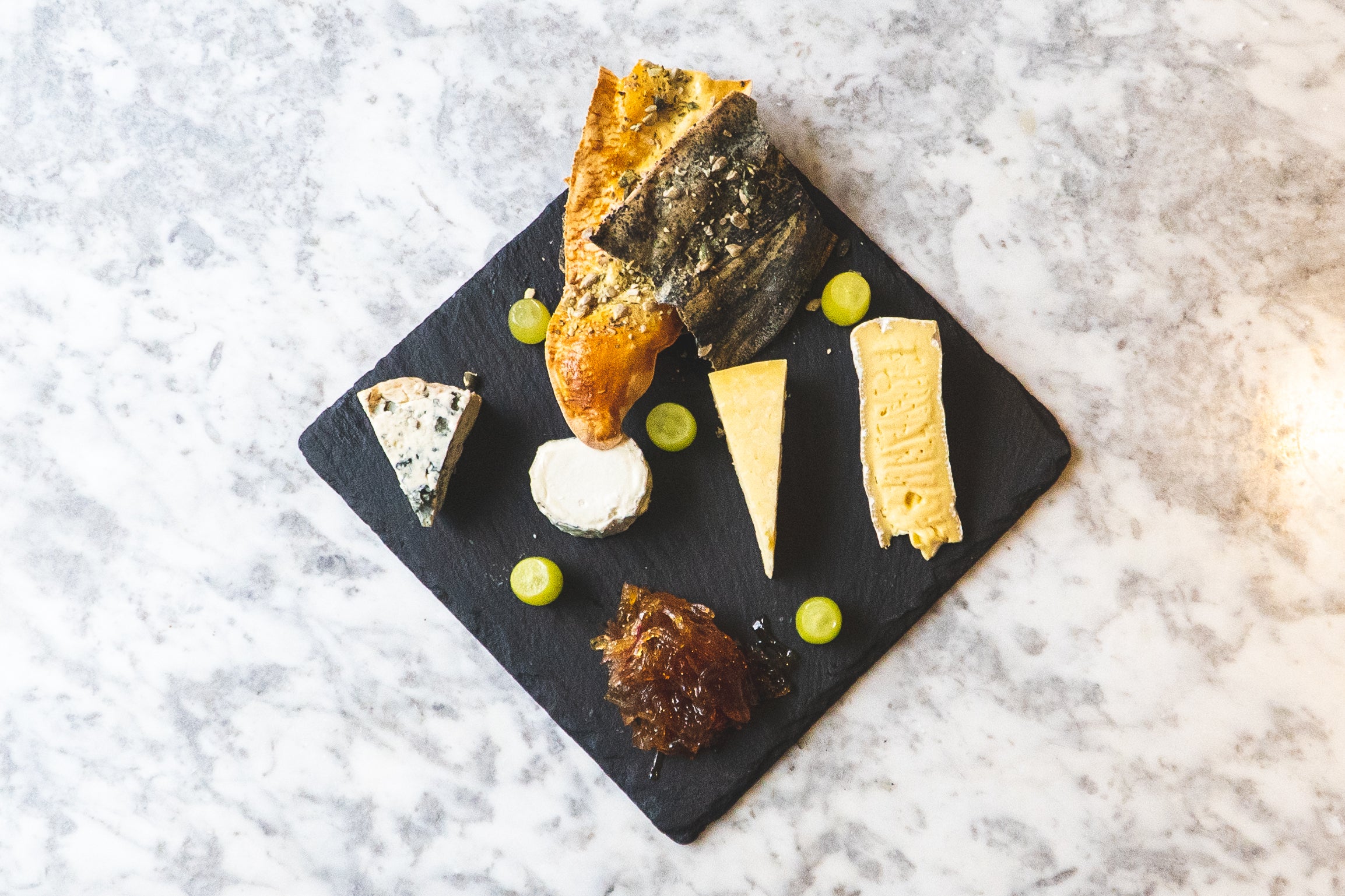 Selection of Cheeses with Crackers, Grapes & Onion Chutney