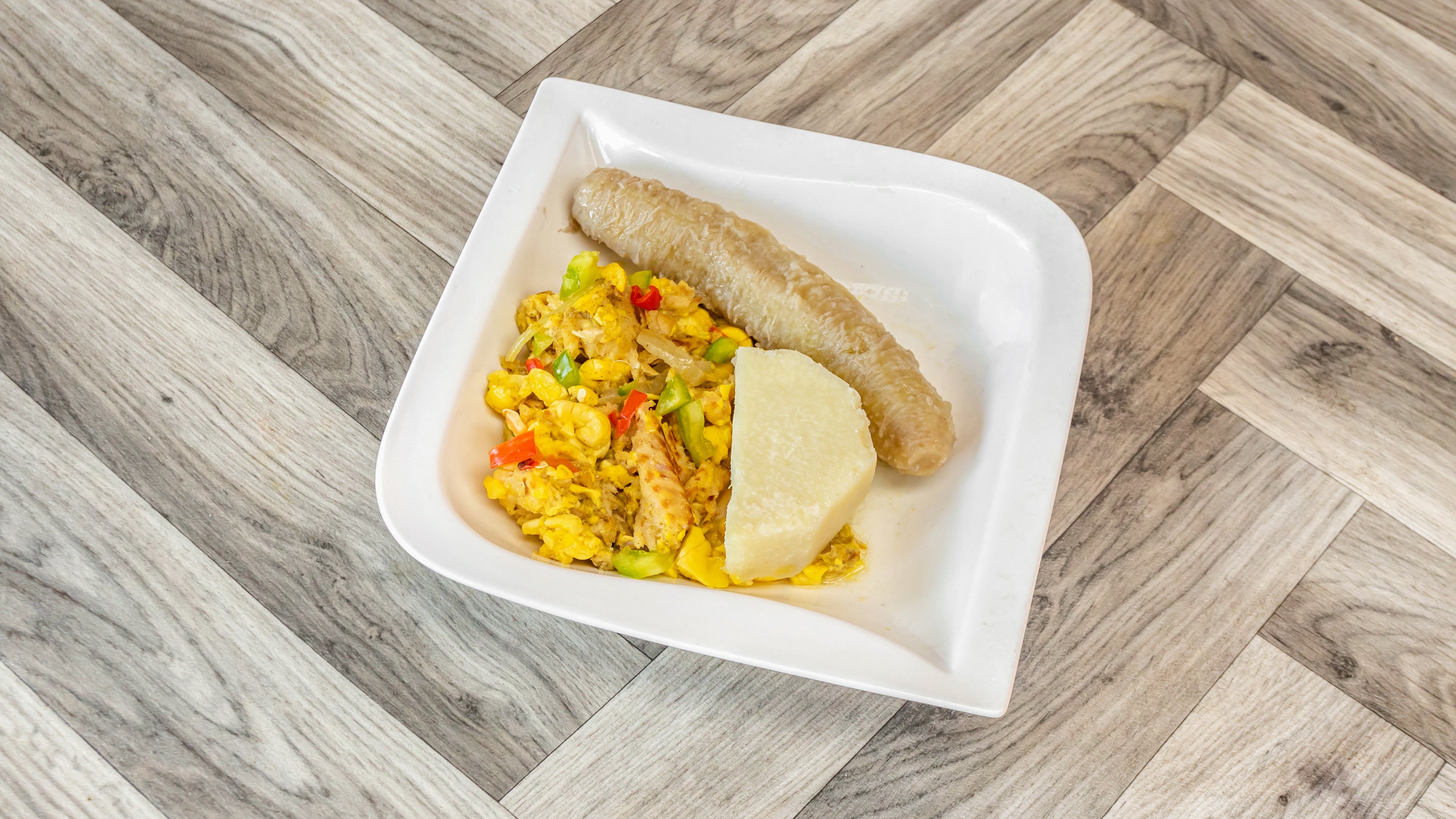 Ackee and Saltfish with one  piece yam and one boiled banana.