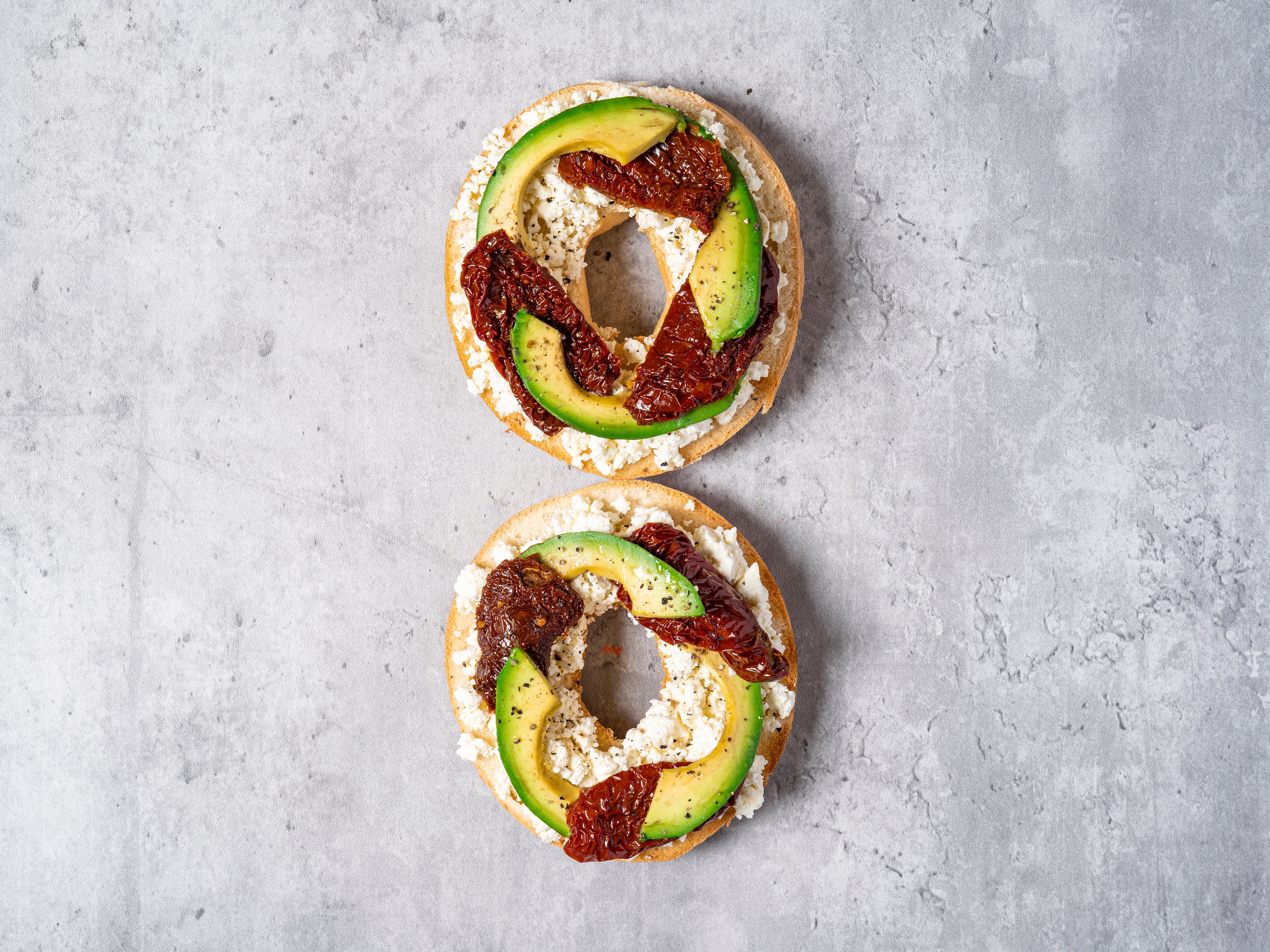 Toasted bagel with avocado, sun-dried tomatoes & Greek cheese 🥑🍅🧀