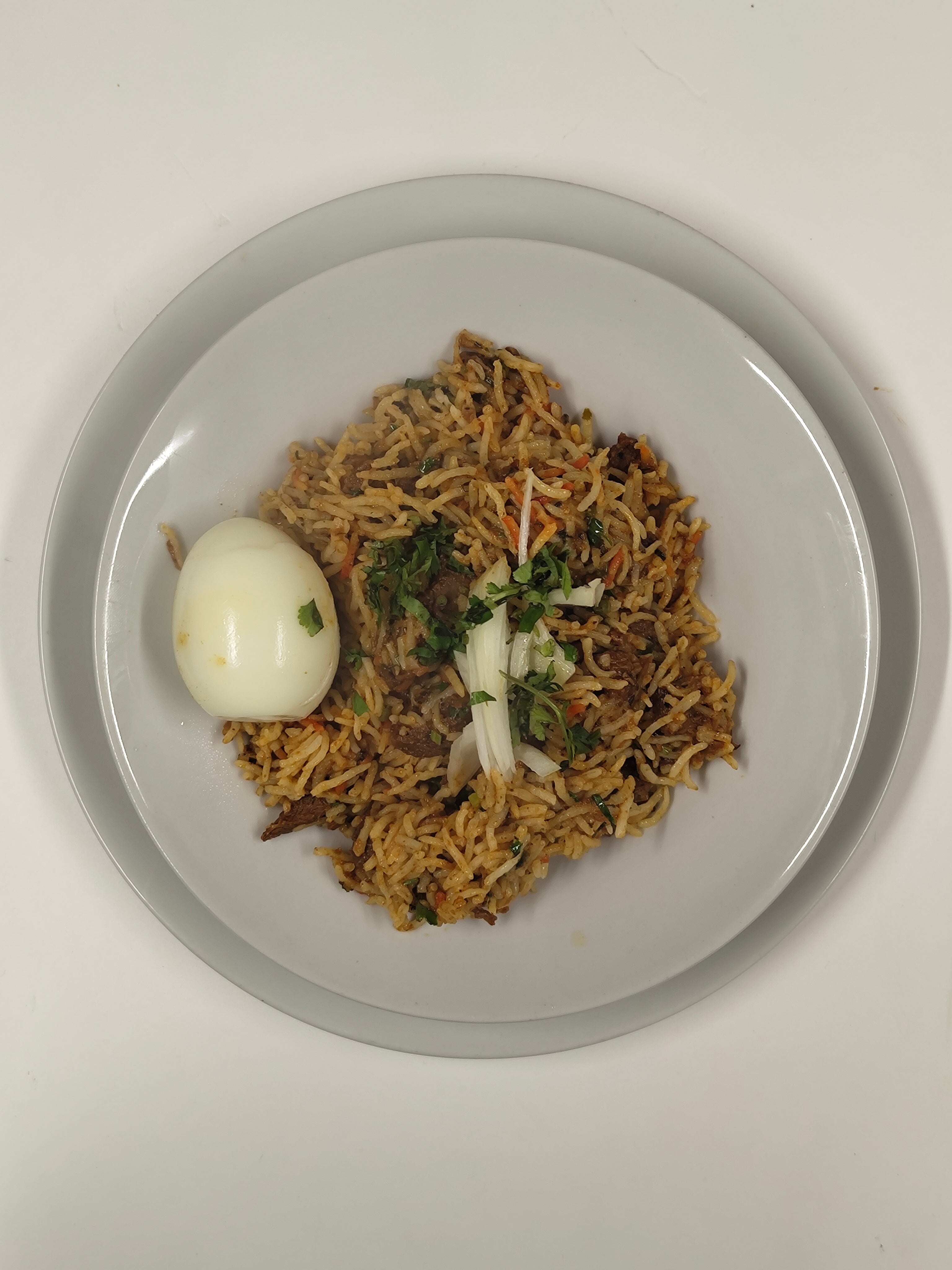 Lamb Biryani Served with Egg  & Raita