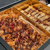 Family box of vine leaves fatteh and musakhan. Family box