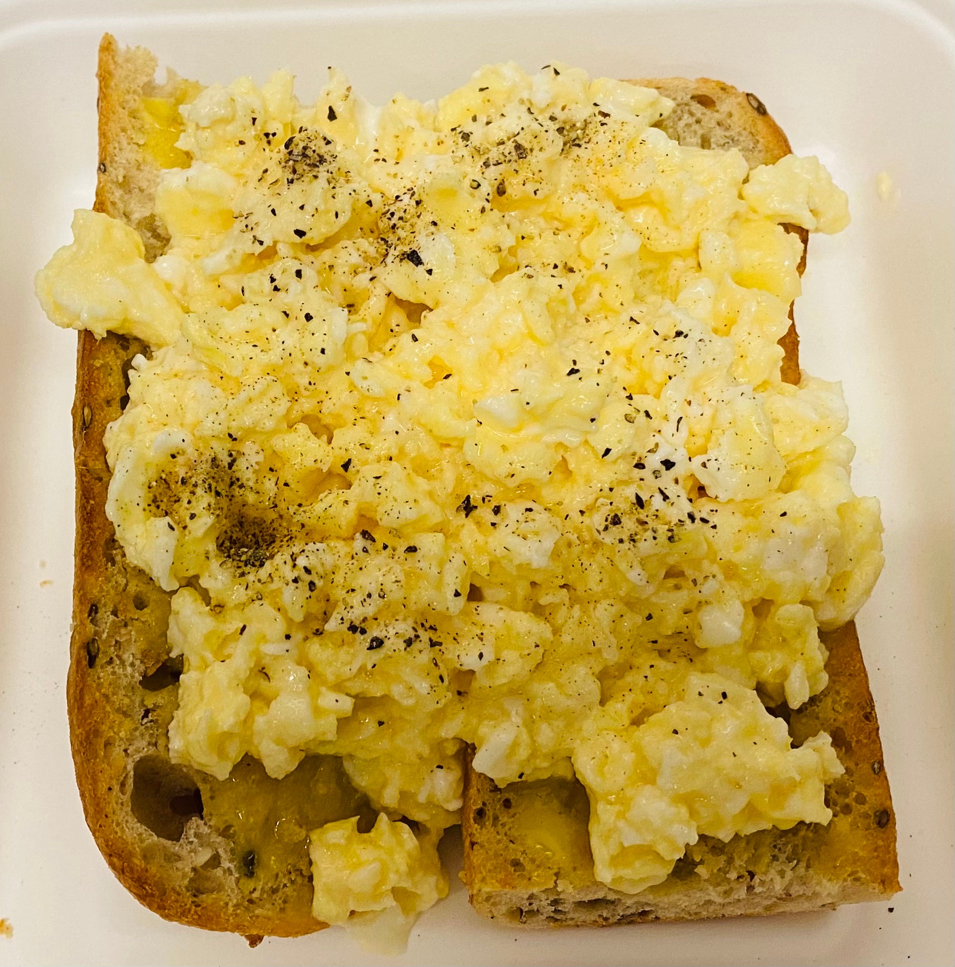 Scramble eggs on sourdough bread