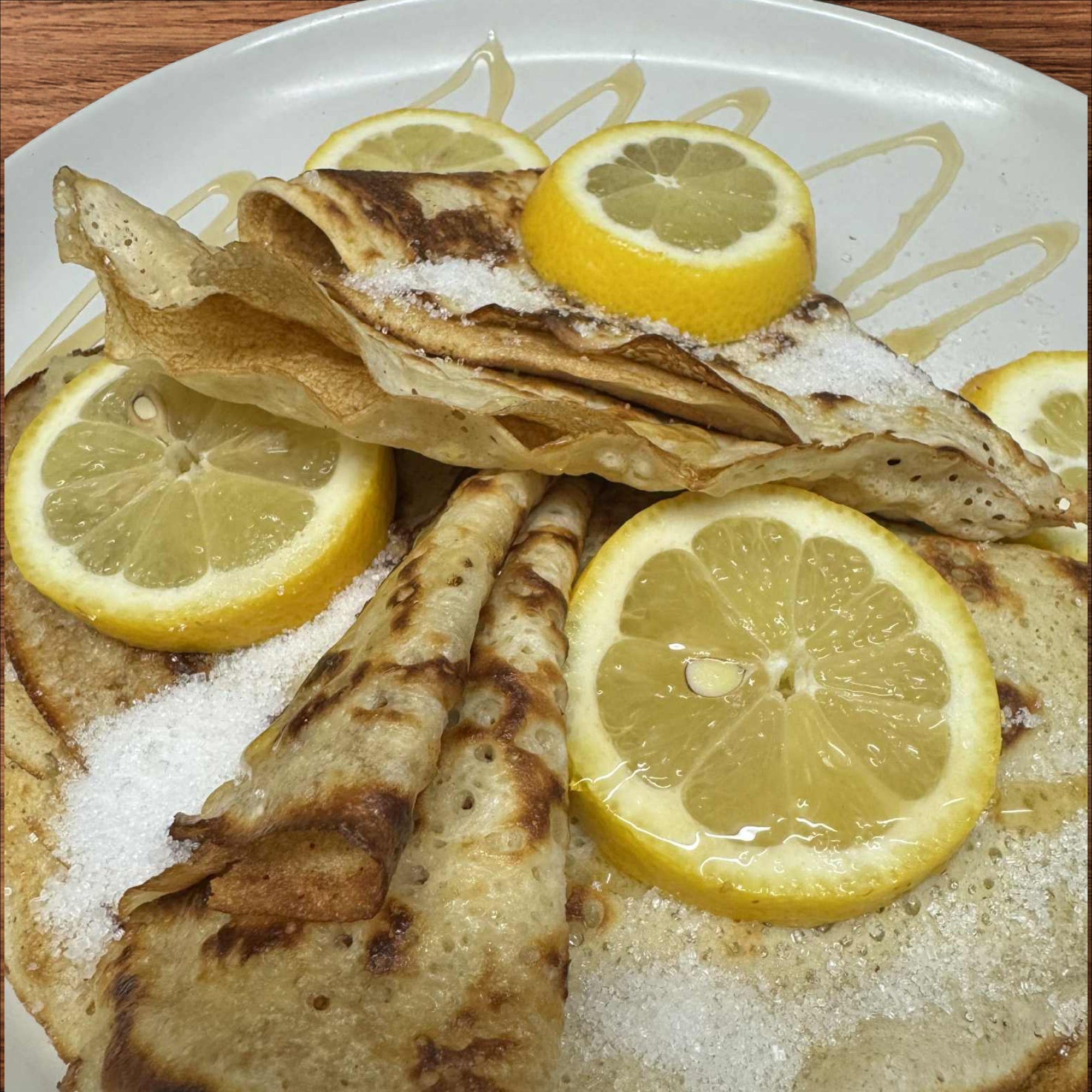 3 Polish-style crapes/ pancakes with lemon and sugar