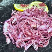 Thin onion slices with sumac