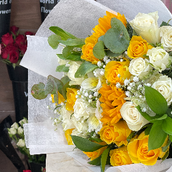 An Assortment Of White And Yellow Flowers