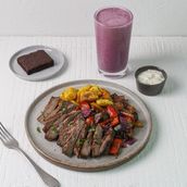 Beef Tenderloin Paired With Roast Veggies Served With A Shake And A Dessert